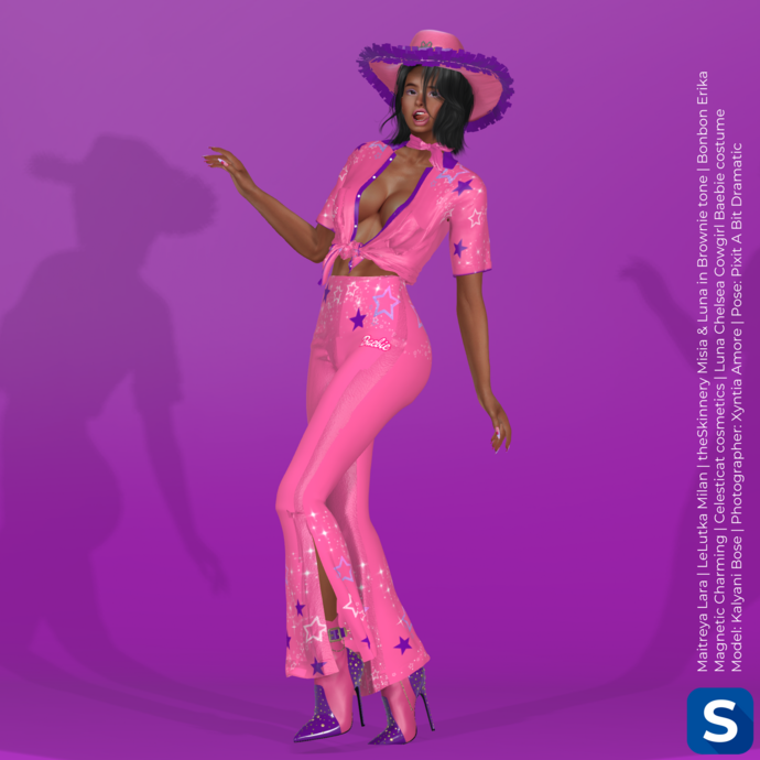 Model Kalyani Bose poses in front of a dark magenta backdrop while wearing a bright pink cowgirl costume that's trimmed in purple.