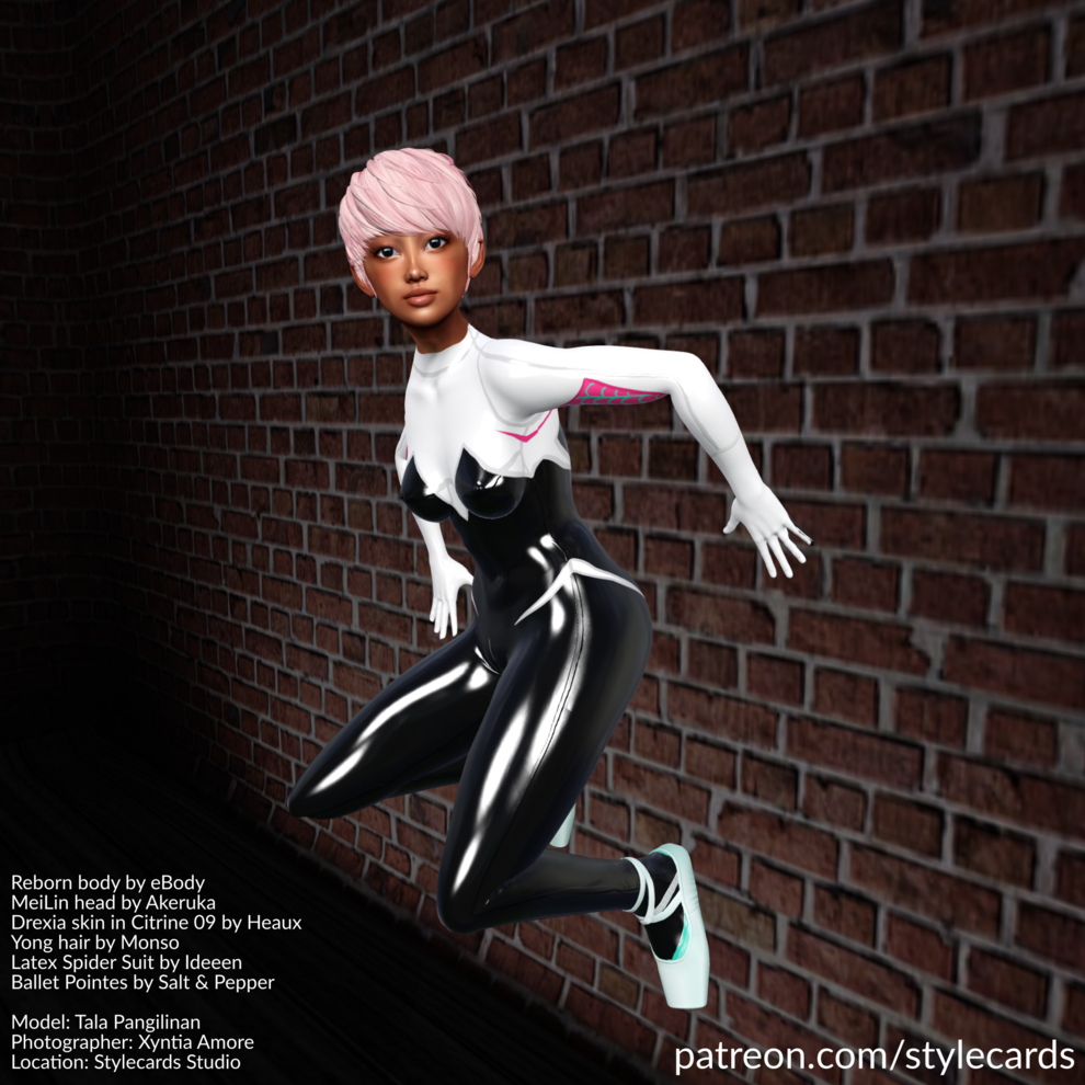Tala Pangilinan is perched on a wall Spider-Man style while wearing a black and white Latex Spider Suit accessorized by a pair of turquoise ballet pointes. Her hair is short and light pink.