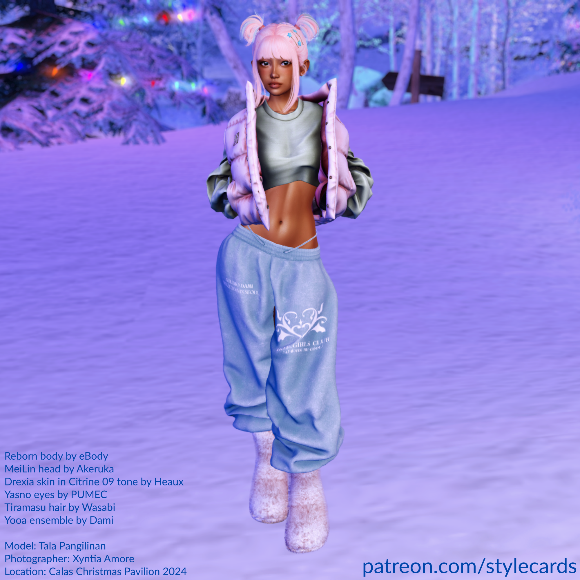 Tala Pangilnan is standing in a snowy forest in some urban streetwear. She is wearing a long-sleeved crop top and a puffy vest around her torso, leaving her midriff exposed. She is also wearing some baggy sweatpants and some very fuzzy boots to keep her feet warm.