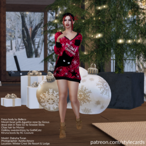 Zuleyha Turan is standing in front of a Christmas display at Winter crest Ski Resort & Lodge. She is wearing an oversized sweater with a red-and-black plaid pattern with a black cat displayed on the front, along with the words 'Meowy Christmas'. She is also sporting a pair of tan Kiruna ankle boots from KC Couture.