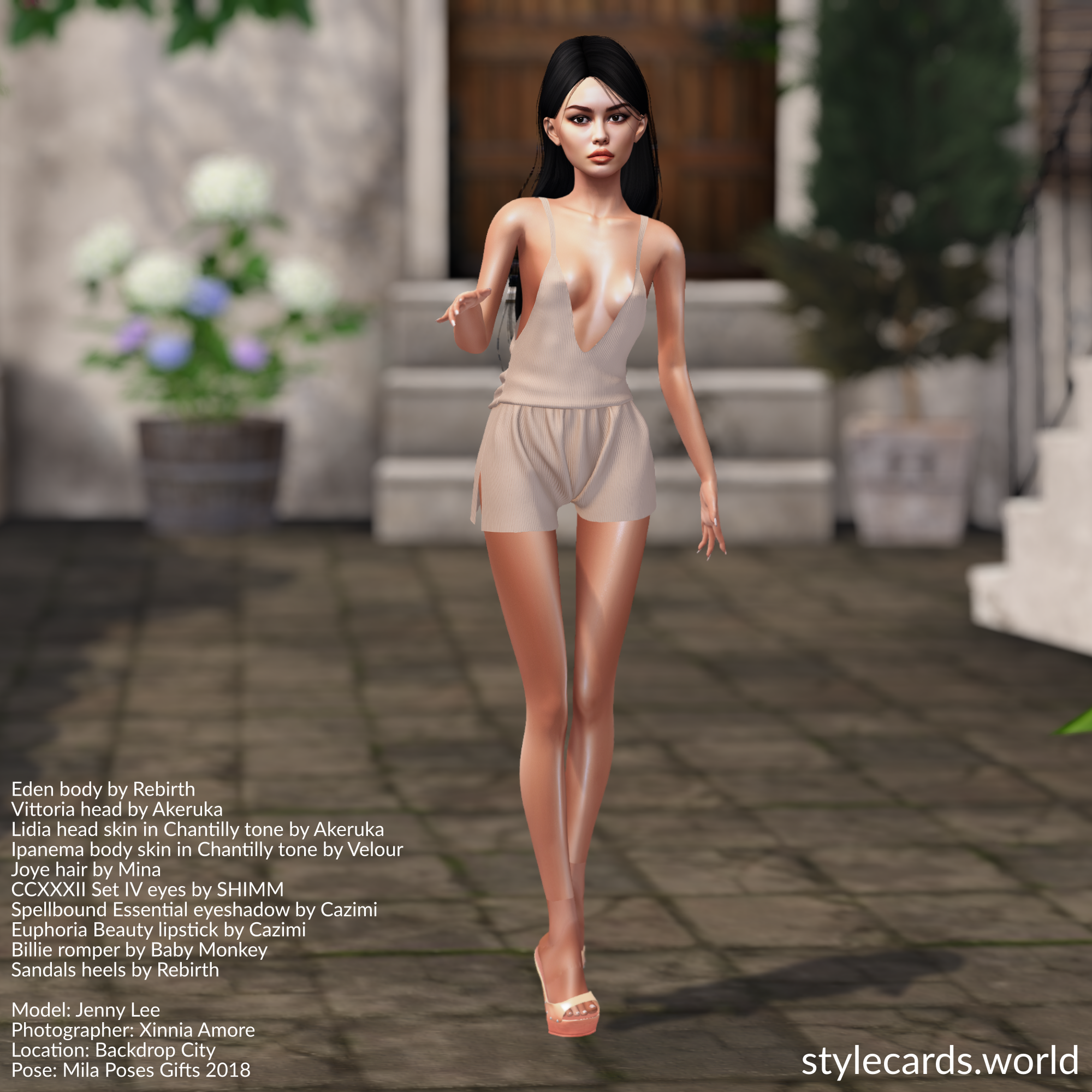 Model Jenny Lee is ready for warmer weather as she poses in a beige romper from Baby Monkey and high-heeled sandals from Rebirth. She has long black hair and dark eyes, and is standing in front of a house in an Italian village.