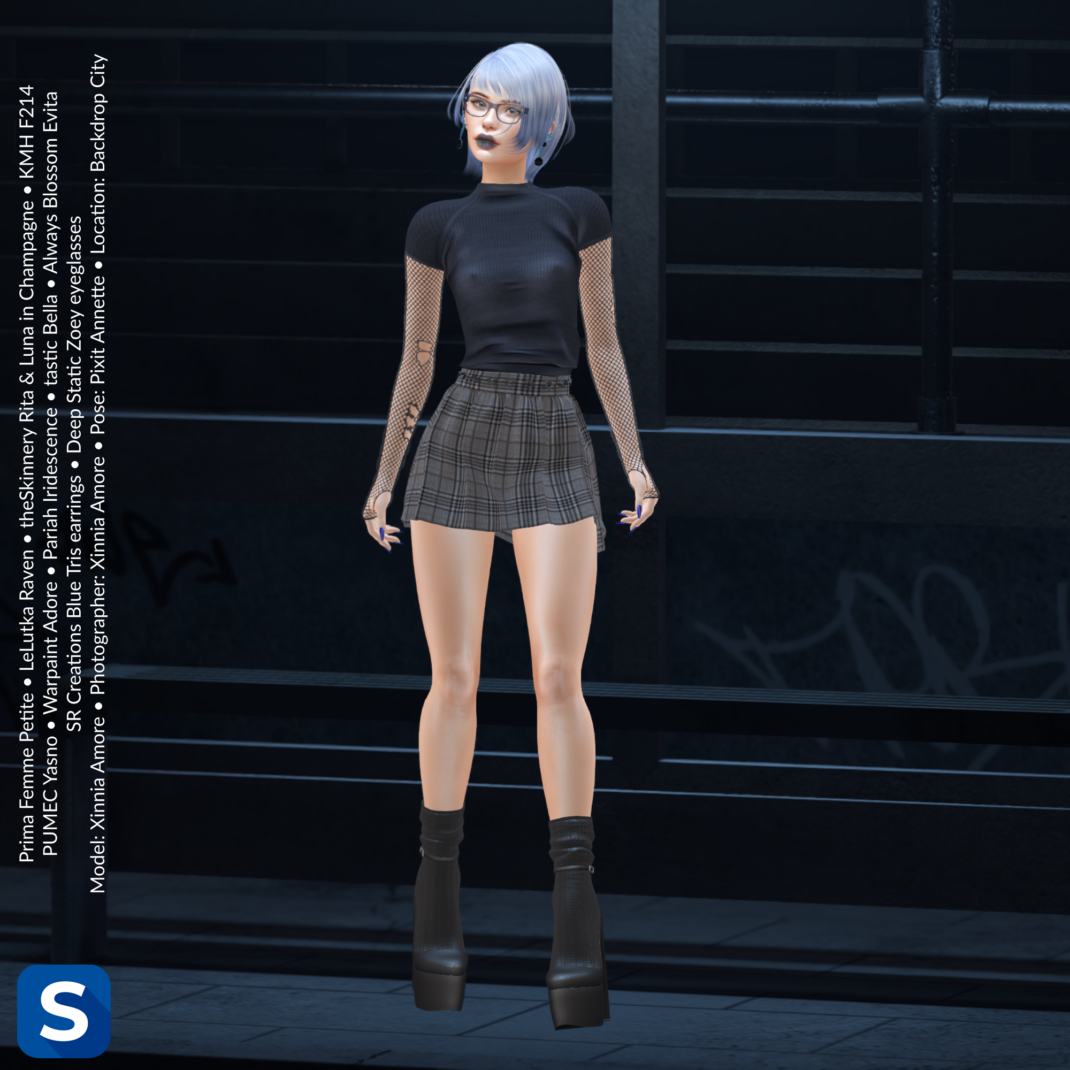 Threadsday, August 20, 2026 A full shot of a woman standing under a covered bus stop at night. Her hair is ombre white and blue, matching her blue eyeglasses frames and earrings. She's wearing a black t-shirt over a black fishnet top, a grey plaid miniskirt, and black boots.