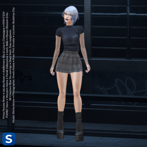 A full shot of a woman standing under a covered bus stop at night. Her hair is ombre white and blue, matching her blue eyeglasses frames and earrings. She's wearing a black t-shirt over a black fishnet top, a grey plaid miniskirt, and black boots.