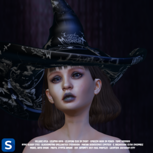 A headshot of a woman with a black witch's hat perched upon her head as she is standing in front of a darkened backdrop. The scleras and irises of her eyes are blackened as if she is cursed by a dark magic. Her eyeshadow and lipstick are both a dark ghoulish grey.
